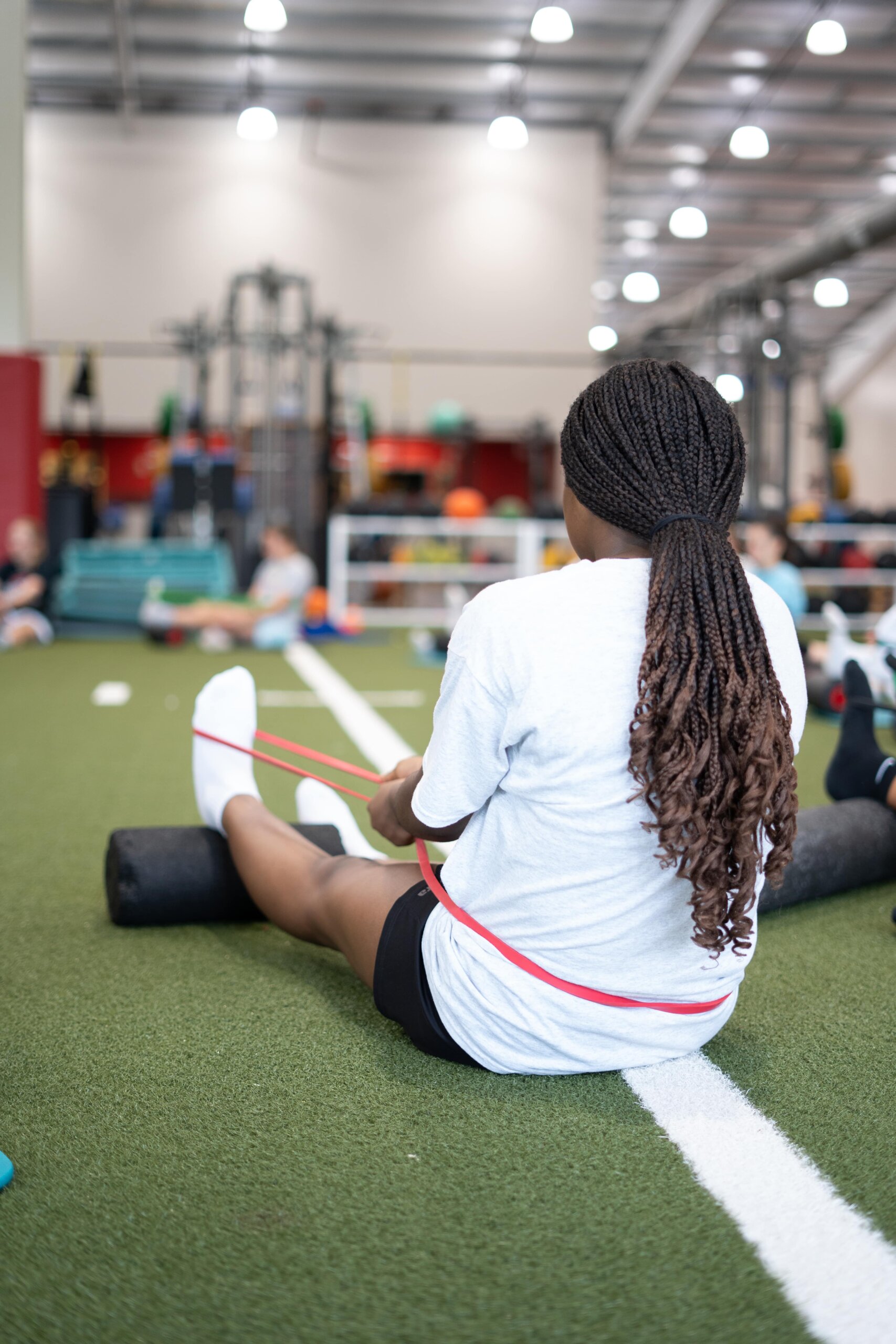 Sports athlete stretching her calf muscle after a workout